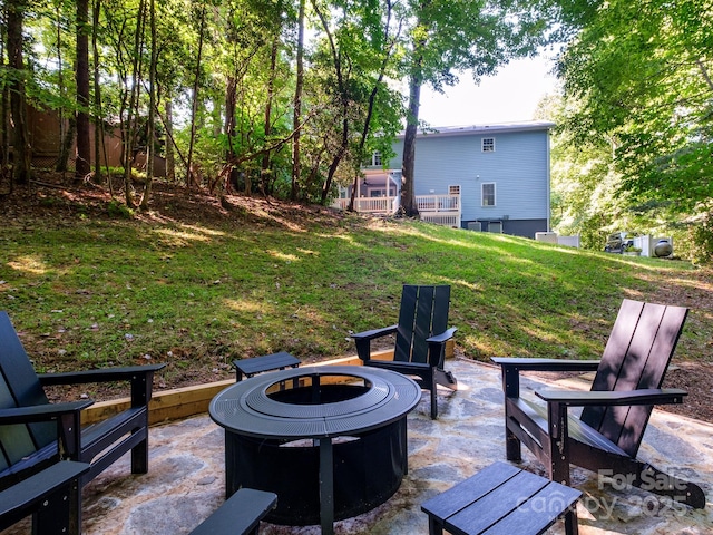 view of yard with a patio and an outdoor fire pit