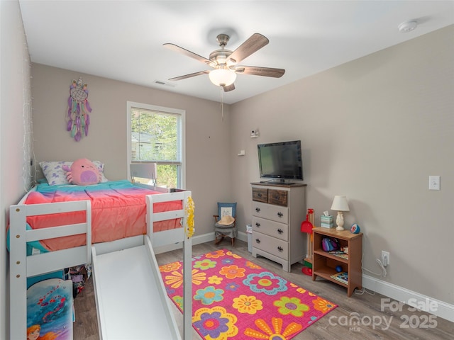 bedroom featuring ceiling fan and hardwood / wood-style flooring