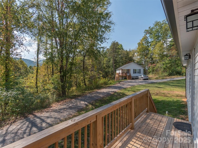 deck featuring a lawn