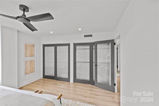 bedroom with ceiling fan, access to exterior, and light hardwood / wood-style floors