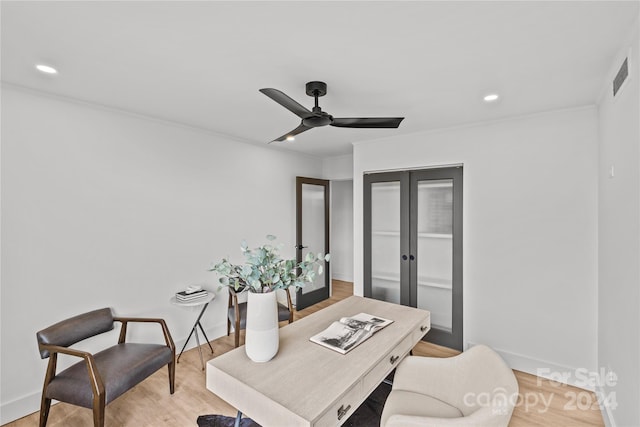 office space with ceiling fan, hardwood / wood-style flooring, and french doors