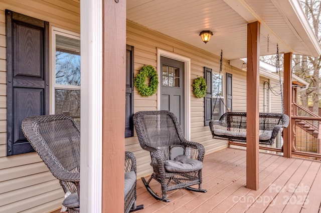 wooden terrace with a porch