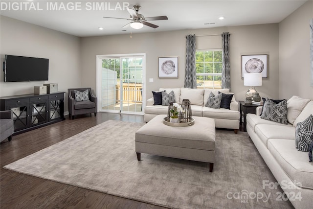 living room featuring hardwood / wood-style flooring and ceiling fan