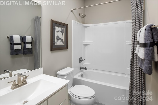 full bathroom featuring shower / bathtub combination with curtain, vanity, and toilet