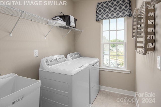 laundry area featuring sink and washer and clothes dryer