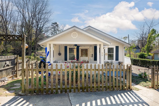 bungalow-style house featuring a porch and ceiling fan