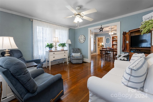 living room with ornamental molding, dark wood-type flooring, and ceiling fan