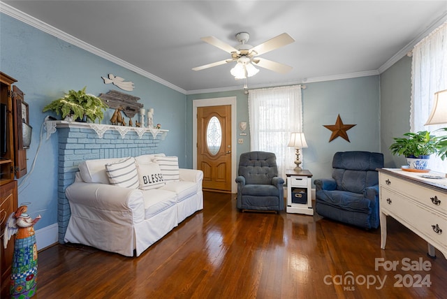 living room featuring dark hardwood / wood-style flooring, ceiling fan, and ornamental molding