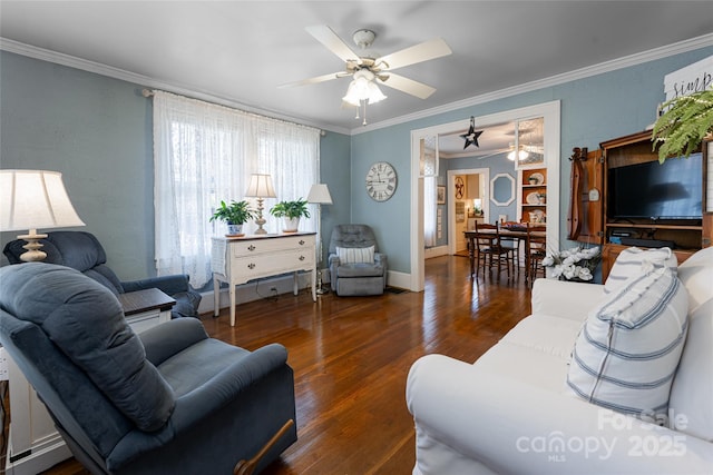 living room featuring a ceiling fan, crown molding, baseboards, and wood finished floors