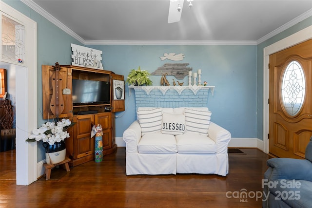 interior space with crown molding, baseboards, and wood finished floors