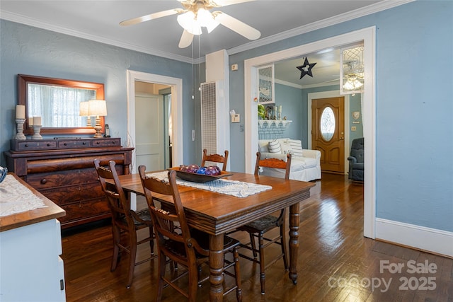 dining room with hardwood / wood-style flooring, crown molding, a ceiling fan, and baseboards