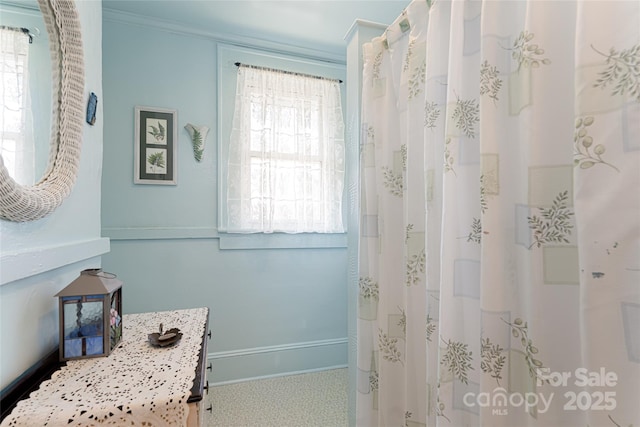 full bathroom featuring baseboards