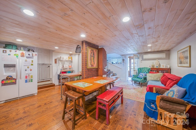 dining space with wood-type flooring, a wall mounted air conditioner, and wood ceiling