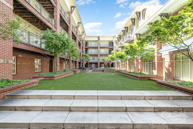 view of home's community featuring a yard