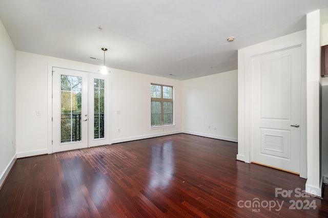 empty room with dark wood-type flooring