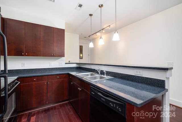 kitchen featuring hanging light fixtures, sink, kitchen peninsula, dark wood-type flooring, and black appliances