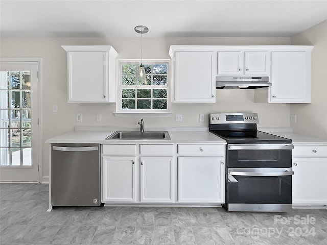 kitchen featuring appliances with stainless steel finishes and white cabinetry