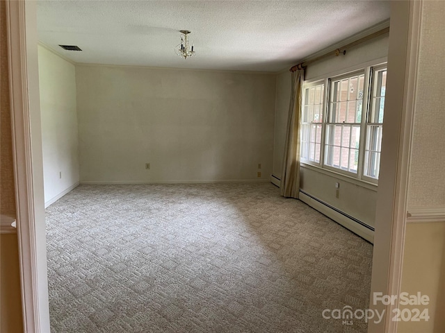 unfurnished room with carpet floors, baseboard heating, and a textured ceiling