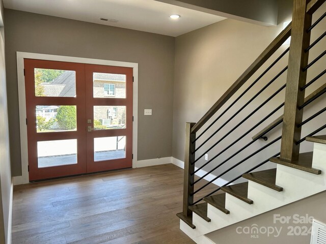1243 10th Street Pl NW, Hickory, NC 28601 - entryway featuring stairs, french doors, wood finished floors, baseboards, and recessed lighting