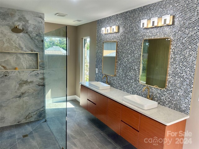 1243 10th Street Pl NW, Hickory, NC 28601 - full bathroom with walk in shower, tile patterned floors, double vanity, and baseboards