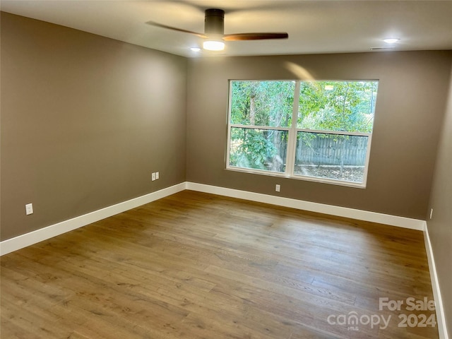 unfurnished room featuring wood-type flooring and ceiling fan