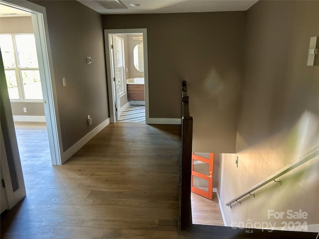 corridor featuring hardwood / wood-style floors