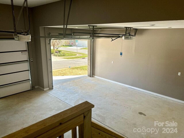 1243 10th Street Pl NW, Hickory, NC 28601 - garage with baseboards and a garage door opener