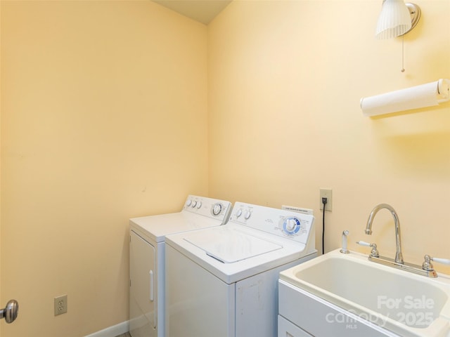 laundry area featuring sink and washer and clothes dryer