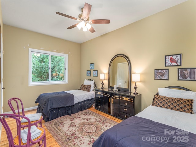 bedroom featuring light hardwood / wood-style flooring and ceiling fan