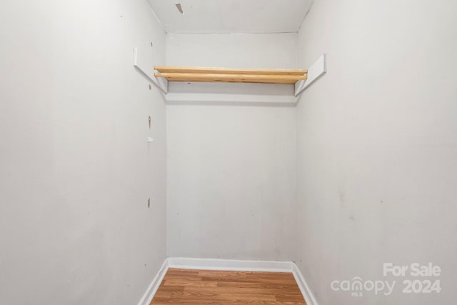 spacious closet featuring hardwood / wood-style floors