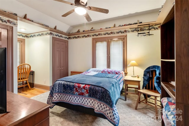 bedroom featuring a closet, light wood-type flooring, and ceiling fan