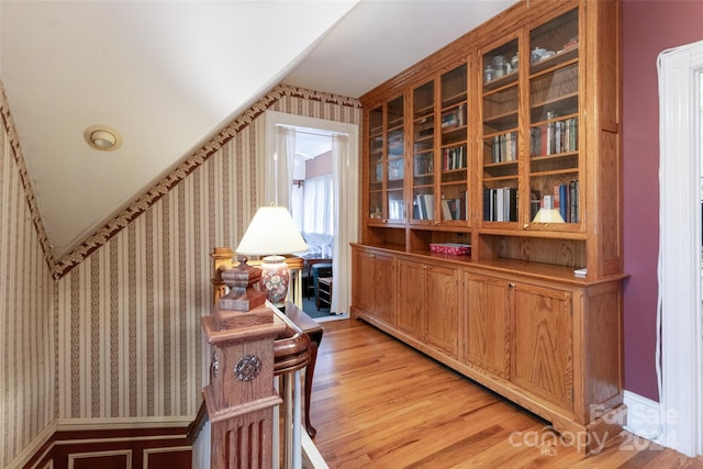 interior space featuring light hardwood / wood-style flooring and vaulted ceiling