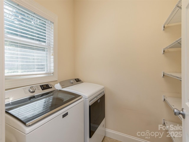 laundry area with laundry area and washer and clothes dryer