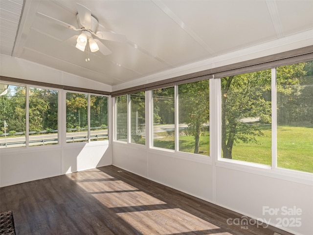 unfurnished sunroom featuring lofted ceiling and a ceiling fan