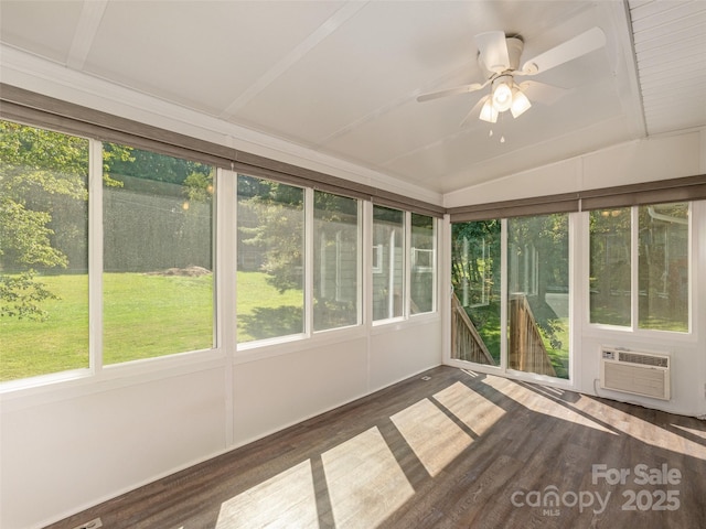 unfurnished sunroom with a ceiling fan, a wealth of natural light, cooling unit, and vaulted ceiling