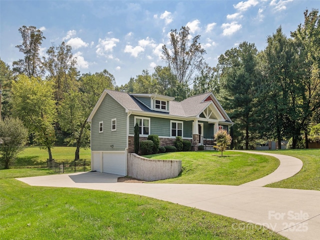 craftsman-style home featuring a garage, a front yard, stone siding, and concrete driveway