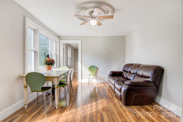 dining space featuring ceiling fan and hardwood / wood-style flooring