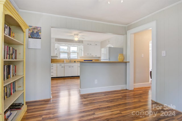 kitchen featuring white cabinets, sink, white fridge, and dark hardwood / wood-style flooring