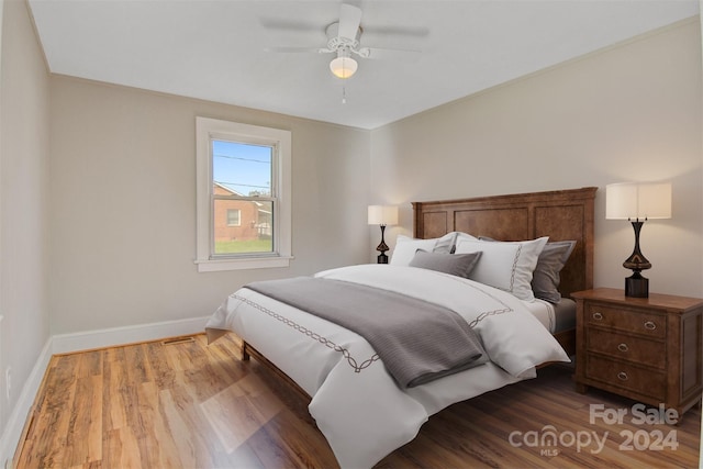 bedroom with ceiling fan and hardwood / wood-style floors