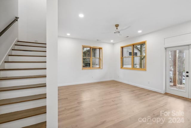 interior space with ceiling fan and light wood-type flooring