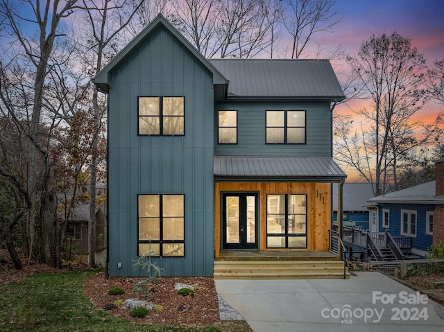 modern farmhouse style home with a porch