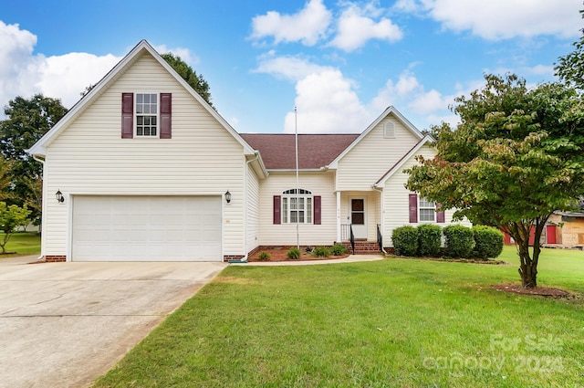 view of front facade with a front yard and a garage