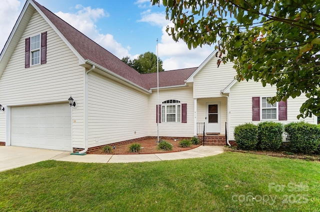 traditional-style home featuring a front yard, concrete driveway, and roof with shingles