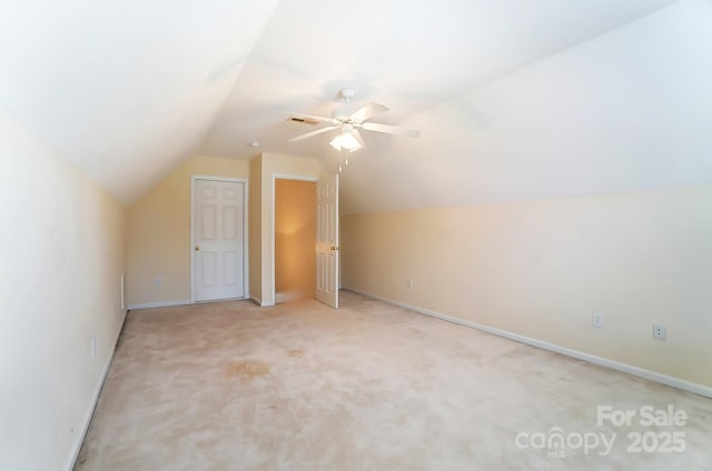 bonus room featuring baseboards, visible vents, lofted ceiling, ceiling fan, and carpet floors