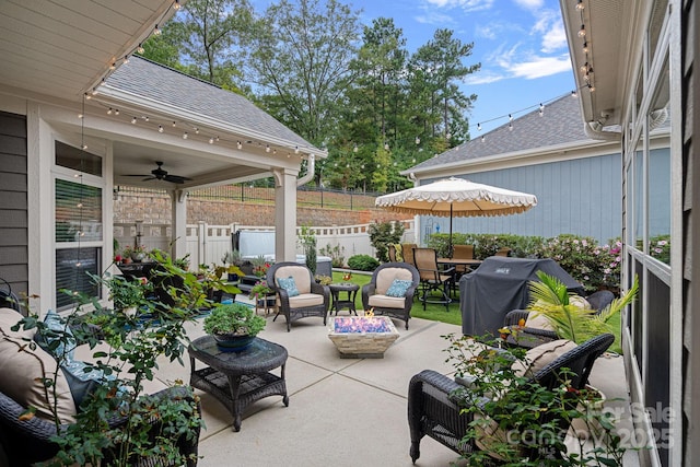 view of patio featuring outdoor lounge area, ceiling fan, and grilling area