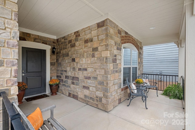 doorway to property with covered porch