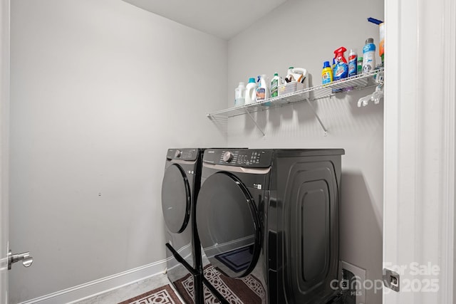 clothes washing area with separate washer and dryer