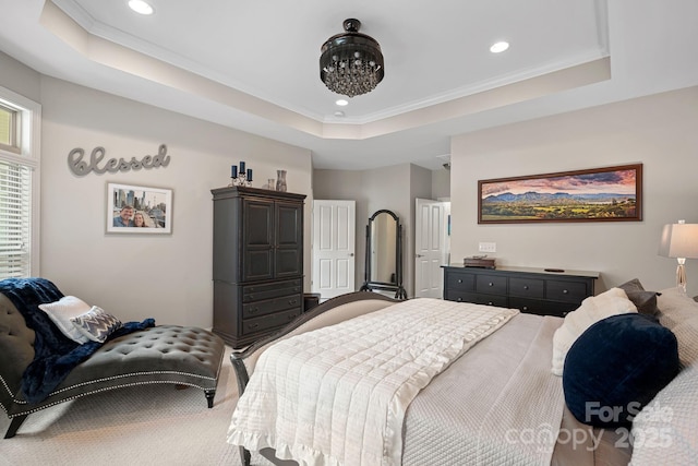 carpeted bedroom with crown molding, a raised ceiling, and a notable chandelier