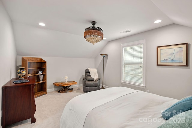 carpeted bedroom with lofted ceiling