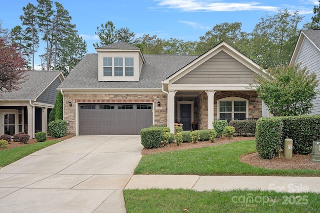 craftsman inspired home with a garage and a front yard